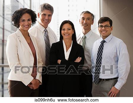 Stock Photograph - Business colleagues standing in office, portrait. Fotosearch