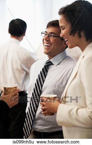 Business colleagues taking a coffee break View Large Photo Image Stock Photograph - Business colleagues taking a coffee break. Fotosearch