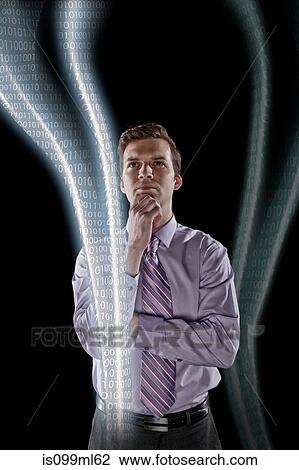 Businessman looking at data streams View Large Photo Image Stock Image - Businessman looking at data streams. Fotosearch