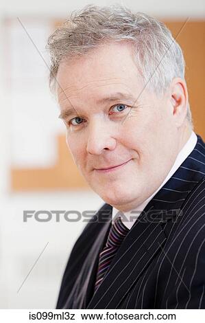 Businessman smiling, portrait View Large Photo Image Stock Photo - Businessman smiling, portrait. Fotosearch