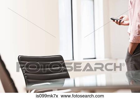 Businessman texting on cell phone View Large Photo Image Stock Photo - Businessman texting on cell phone. Fotosearch