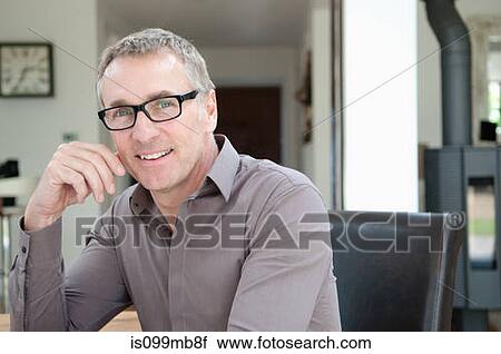 Businessman wearing glasses, portrait View Large Photo Image Stock Image - Businessman wearing glasses, portrait. Fotosearch