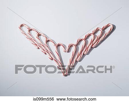 Candy canes in heart shape View Large Photo Image Stock Photograph - Candy canes in heart shape. Fotosearch