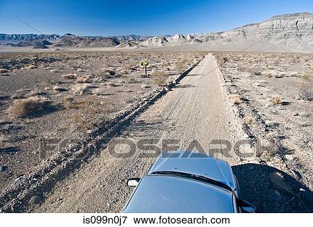 Stock Photo - Car on desert road in Death Valley National Park, California, USA. Fotosearch
