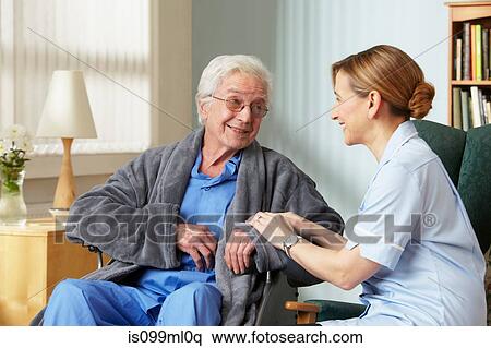 Carer touching senior mans arm View Large Photo Image Stock Photography - Carer touching senior mans arm. Fotosearch