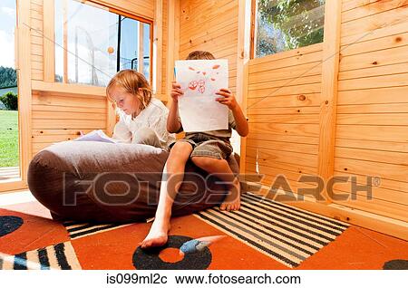 Children in a wooden playhouse View Large Photo Image Stock Image - Children in a wooden playhouse. Fotosearch