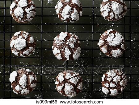 Chocolate puff cookies cooling on rack View Large Photo Image Stock Photograph - Chocolate puff cookies cooling on rack. Fotosearch