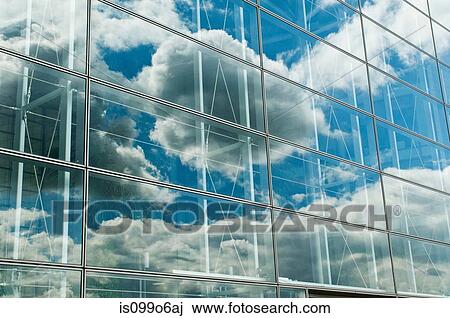 Cloudy blue sky reflected in office windows View Large Photo Image Stock Image - Cloudy blue sky reflected in office windows. Fotosearch