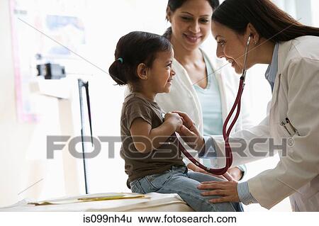 Stock Photograph - Doctor listening to young girl's chest with stethoscope. Fotosearch