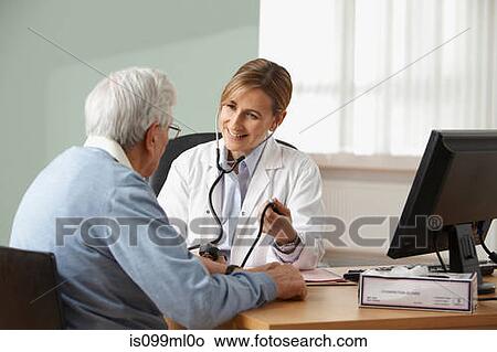 Doctor taking senior mans blood pressure View Large Photo Image Picture - Doctor taking senior mans blood pressure. Fotosearch