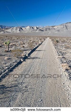 Stock Photo - Empty desert road in Death Valley National Park, California, USA. Fotosearch