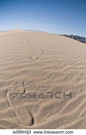 Stock Image - Footprints in sand dune in Death Valley National Park, California, USA. Fotosearch