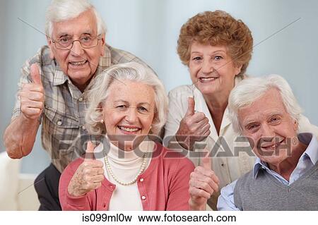Four seniors with thumbs up, portrait View Large Photo Image Stock Photo - Four seniors with thumbs up, portrait. Fotosearch