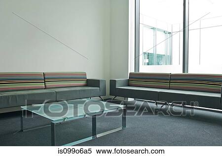 Glass table and sofas in empty office block View Large Photo Image Stock Photography - Glass table and sofas in empty office block. Fotosearch