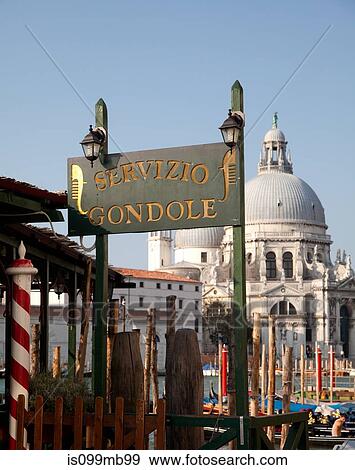 Stock Photo - Gondola sign and santa maria della salute, venice, italy. Fotosearch