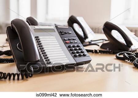 Landline phones on desk View Large Photo Image Stock Image - Landline phones on desk. Fotosearch