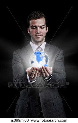 Man holding holographic globe View Large Photo Image Stock Image - Man holding holographic globe. Fotosearch