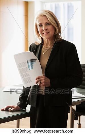 Mature businesswoman in office, portrait View Large Photo Image Stock Image - Mature businesswoman in office, portrait. Fotosearch