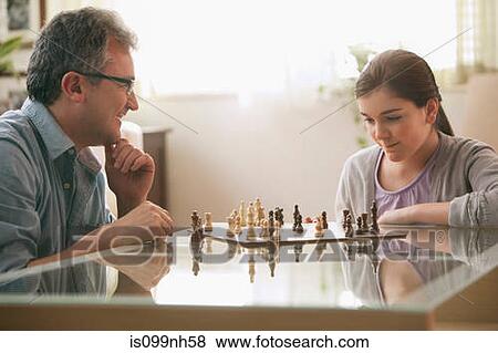 Mature man playing chess with daughter View Large Photo Image Stock Photo - Mature man playing chess with daughter. Fotosearch