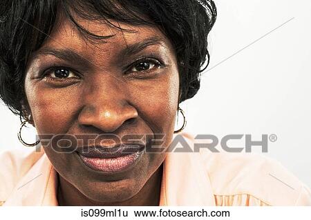 Mature woman looking at camera View Large Photo Image Stock Photograph - Mature woman looking at camera. Fotosearch