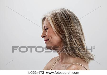 Stock Image - Mature woman, side view. Fotosearch