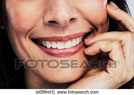 Mature woman touching cheek, cropped View Large Photo Image Stock Image - Mature woman touching cheek, cropped. Fotosearch