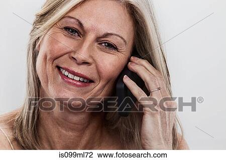 Mature woman touching face View Large Photo Image Stock Image - Mature woman touching face. Fotosearch