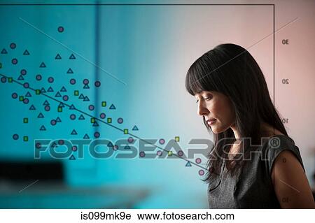 Mature woman with diagram of shapes on window View Large Photo Image Stock Image - Mature woman with diagram of shapes on window. Fotosearch