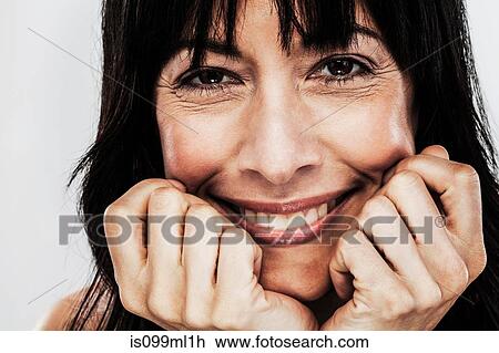 Mature woman with hand on chin View Large Photo Image Stock Image - Mature woman with hand on chin. Fotosearch