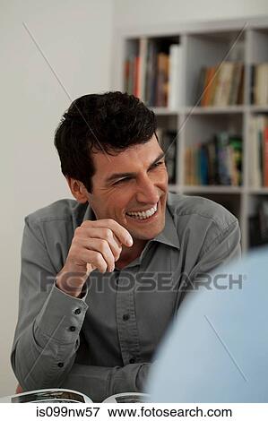 Mid adult man smiling in gallery View Large Photo Image Stock Photo - Mid adult man smiling in gallery. Fotosearch
