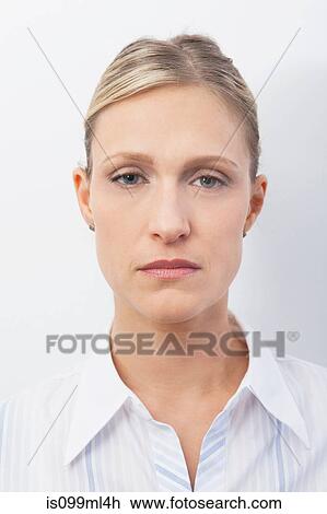 Mid adult woman with serious expression, portrait View Large Photo Image Stock Image - Mid adult woman with serious expression, portrait. Fotosearch
