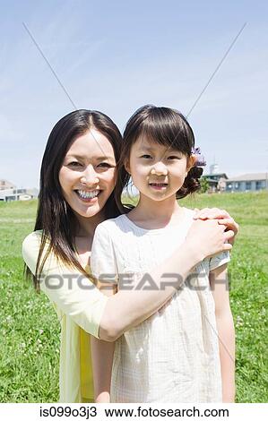 Mother and daughter outdoors View Large Photo Image Stock Image - Mother and daughter outdoors. Fotosearch