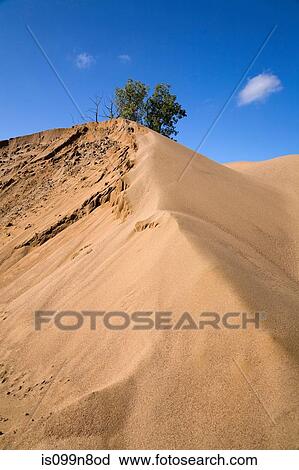 Mound of sand in commerical sand pit View Large Photo Image Stock Image - Mound of sand in commerical sand pit. Fotosearch