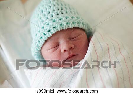 Stock Image - Newborn baby boy, asleep. Fotosearch