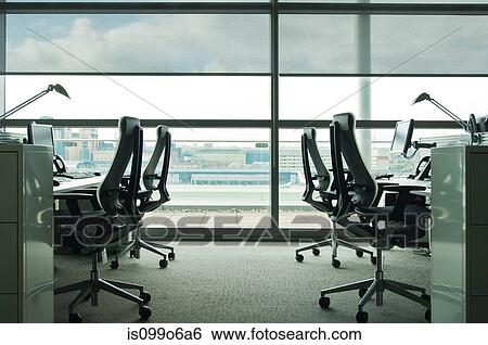 Office chairs in empty office block View Large Photo Image Stock Photograph - Office chairs in empty office block. Fotosearch
