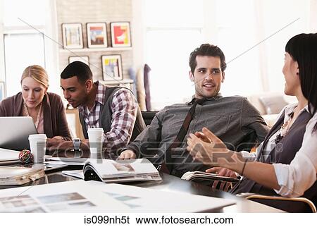 Office colleagues in meeting View Large Photo Image Stock Photograph - Office colleagues in meeting. Fotosearch