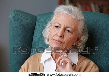 Stock Image - Pensive senior woman, portrait. Fotosearch