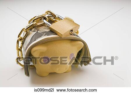 Piggy bank with bank notes and padlock View Large Photo Image Stock Image - Piggy bank with bank notes and padlock. Fotosearch