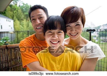 Portrait of a happy family outdoors View Large Photo Image Stock Image - Portrait of a happy family outdoors. Fotosearch