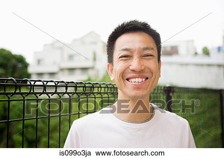 Portrait of a happy man outdoors View Large Photo Image Stock Image - Portrait of a happy man outdoors. Fotosearch