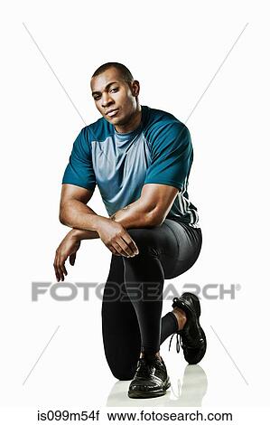 Portrait of athlete kneeling View Large Photo Image Stock Image - Portrait of athlete kneeling. Fotosearch