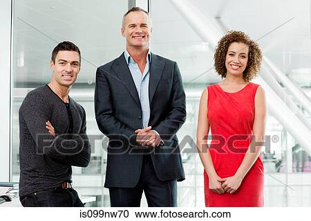 Stock Image - Portrait of business colleagues in office. Fotosearch