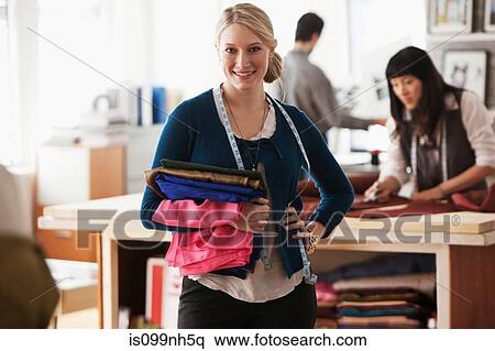 Portrait of fashion designer in studio View Large Photo Image Stock Photography - Portrait of fashion designer in studio. Fotosearch