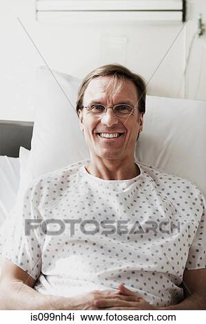 Portrait of mature patient in hospital View Large Photo Image Stock Image - Portrait of mature patient in hospital. Fotosearch