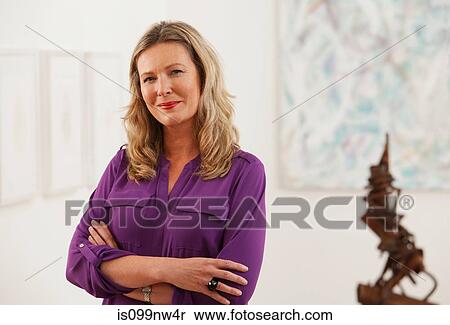 Portrait of mid adult gallery owner View Large Photo Image Stock Photography - Portrait of mid adult gallery owner. Fotosearch