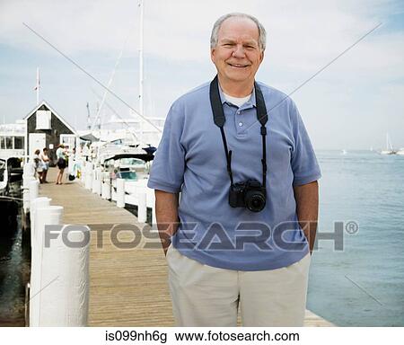 Portrait of senior man on vacation View Large Photo Image Stock Image - Portrait of senior man on vacation. Fotosearch