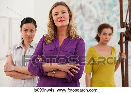 Portrait of three gallery owners in art gallery View Large Photo Image Stock Photograph - Portrait of three gallery owners in art gallery. Fotosearch