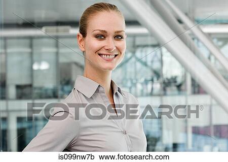 Portrait of young businesswoman, smiling View Large Photo Image Stock Image - Portrait of young businesswoman, smiling. Fotosearch