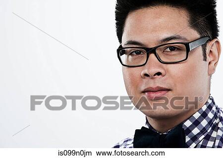 Portrait of young man against white background View Large Photo Image Picture - Portrait of young man against white background. Fotosearch