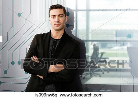 Portrait of young man in IT office View Large Photo Image Stock Photography - Portrait of young man in IT office. Fotosearch
